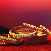 Gold emobossed designs with stone matte finish bangles