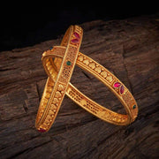 Bangles in Glossy Gold Tone with Rich Carvings & Spinal Stone